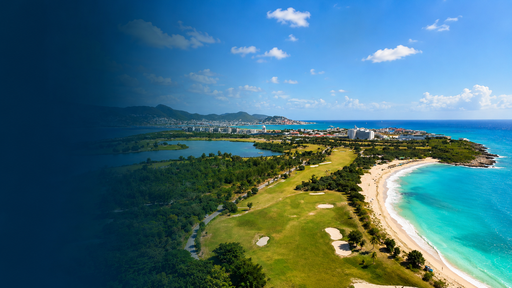 Aerial view of St. Maarten coastline with turquoise Caribbean waters